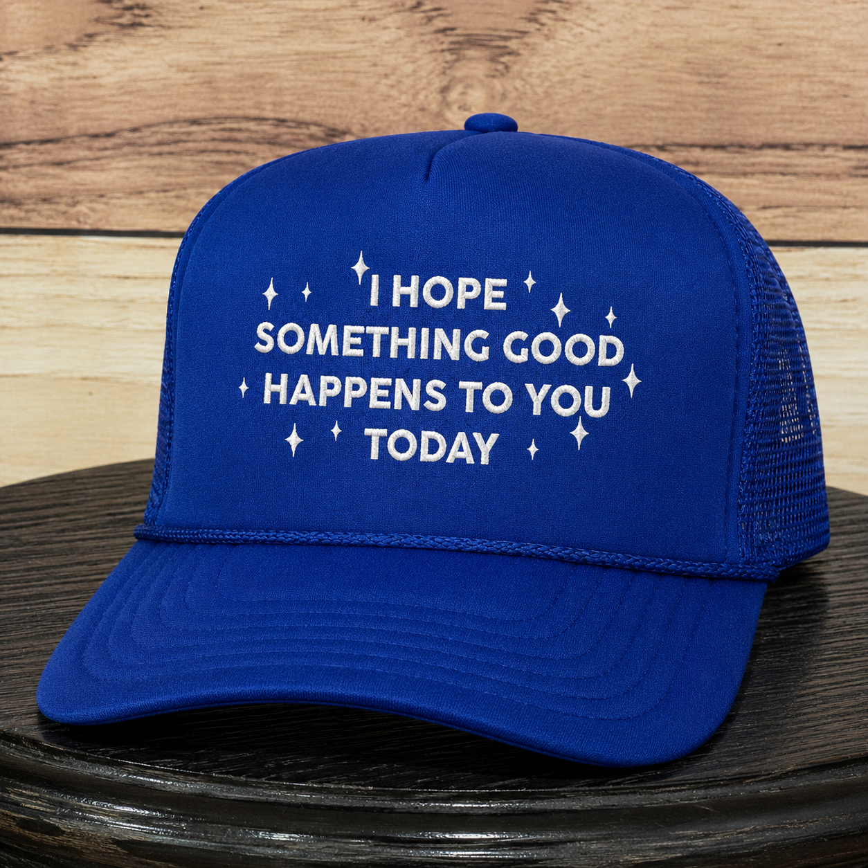 Royal blue embroidered foam trucker hat featuring "I Hope Something Good Happens to You Today" inspirational quote, structured trucker cap with premium embroidery and curved brim.